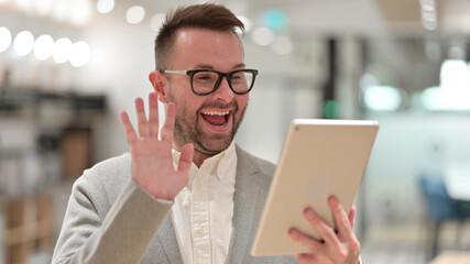 Caucasian Young man doing Video Call on Digital Tablet