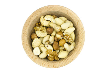 Mixed nuts in wooden bowl isolated on white background top view