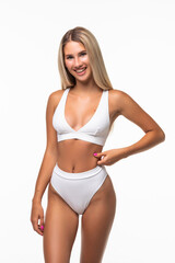 Fototapeta premium Portrait of happy beautiful fit woman on white background