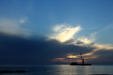 Naklejka na ściany i meble silhouette, big boat and beautiful sunrise nature