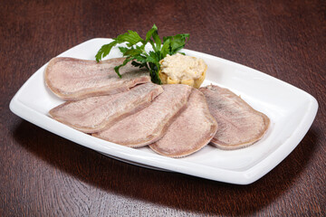 Sliced beef tongue on the plate