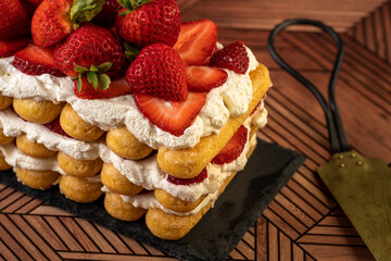 Homemade layered strawberry cake with ladyfingers 
