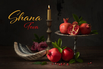 Jewish holiday Rosh Hashanah banner design with pomegranates, red apples, shofar (horn) and burning...