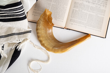 Religion image of Shofar (horn), Tallit (Prayer Shawl)  and Prayer book religious symbols. Rosh...