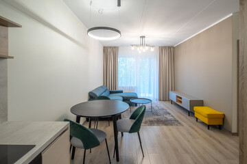 Modern light interior of living room in studio apartment. Furniture.