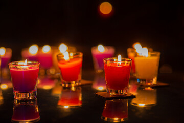 burning candles in a glass
