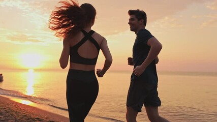 Back view young couple two friends family man woman together wear sports clothes warm up warm up train running jogging at sunrise sun dawn over sea beach outdoor on pier seaside in summer day evening - Powered by Adobe