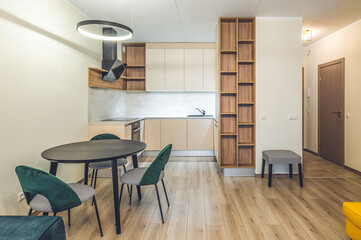 Modern light interior of studio apartment. Kitchen. Living room.