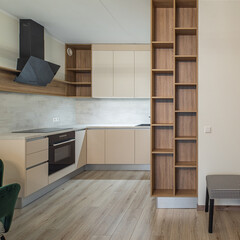 Modern light interior of studio apartment. Kitchen. Living room.