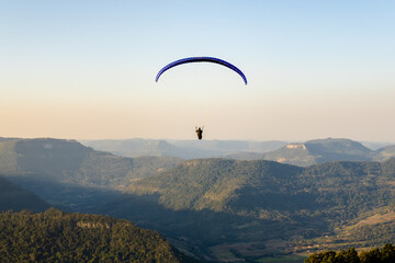 View from a paraglider in the Ninho das Águias mountain range in Nova Petrópolis with people watching and recording the takeoff moment. Place used for panoramic flights with incredible natural beauty.