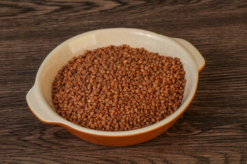 Raw buсkwheat cereal in the bowl