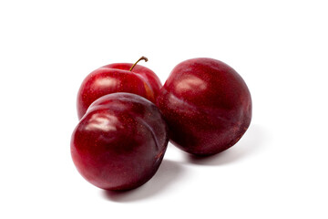 red plums isolated on white background