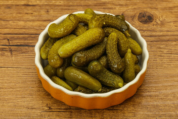 Pickled gherkin in the bowl