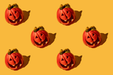Pumpkin is an autumn vegetable. Seamless pattern. Yellow background. Halloween.