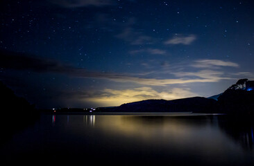 Calm lake reflecting the last light of dusk © joangasconcomas