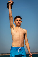 Kettlebell exercises on a beach