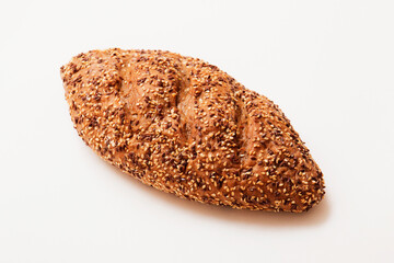 Bread, pastries. Bread with sesame seeds and seeds, bread texture. Delicious flavored bun.