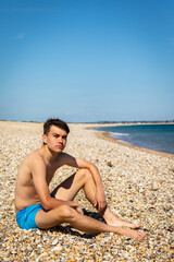 Fototapeta na wymiar Relaxing on a beach next to the sea