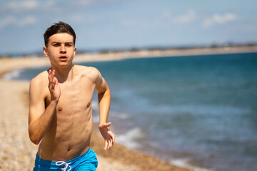 Running on a beach next to the sea