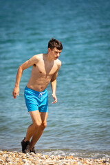 Fototapeta na wymiar Running on a beach next to the sea