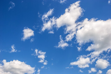 Blue sky with white heap clouds.