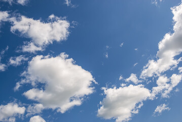 Blue sky with white heap clouds.