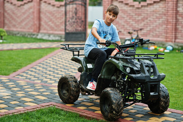 Boy in four-wheller ATV quad bike. © AS Photo Family