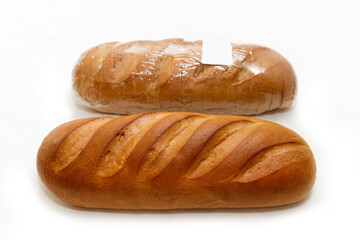White fresh bread with a crisp crust lies for sale in a bakery