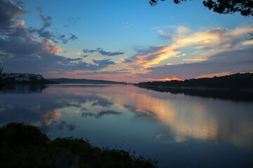 landscape with water colors red blue sunset