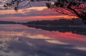 landscape with water colors red blue sunset