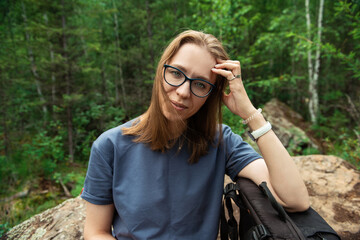 Healthy lifestyle woman walking and restiing in summer forest area