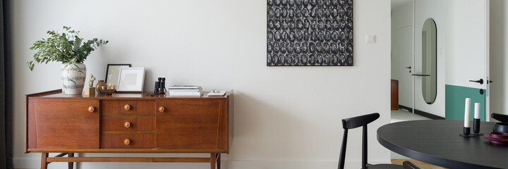 Stylish and vintage sideboard with decorations, panorama