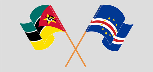 Crossed and waving flags of Mozambique and Cape Verde