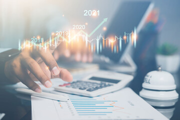 Business financial technology in 2021. Business analysts show statistics on collecting increase in income of business entities in the year.