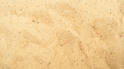 Yellow sand beach background top view Yellow sand beach background top view with small pebbles
