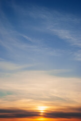 Naklejka na ściany i meble Dramatic sunset sky with clouds.