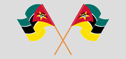 Crossed and waving flags of Mozambique