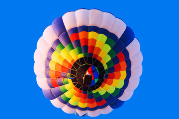 Bright multi-colored balloon in the blue sky