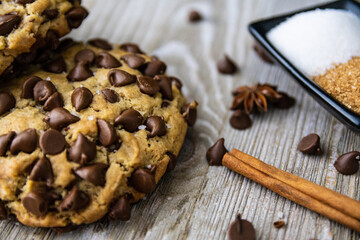 Extra chunky chocolate chip cookie on wooden table