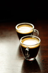 two glass coffee cup with espresso near the window in morning