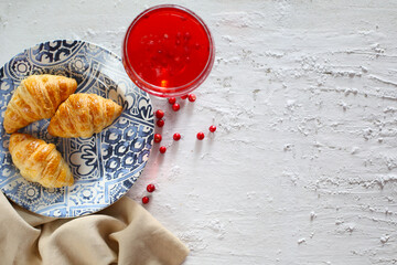 This photo shows croissants with a lingonberry drink © m.zh