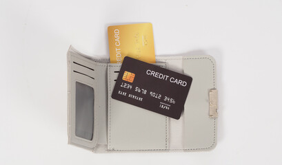 Credit card Black and gold color with in grey wallet isolated on white background..