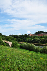 Fototapeta na wymiar Panoramic view of the river and the fortress wall. Dnieper and red brick wall.