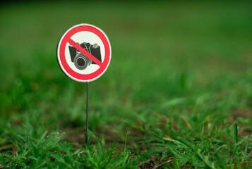 A round sign prohibiting the camera from taking photos is crossed out with a red line. An empty...