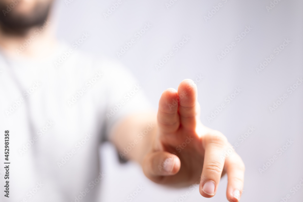 Poster Hand pushing on a touch screen..