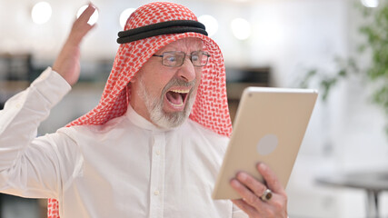 Portrait of Senior Old Arab Businessman Reacting to Loss on Tablet