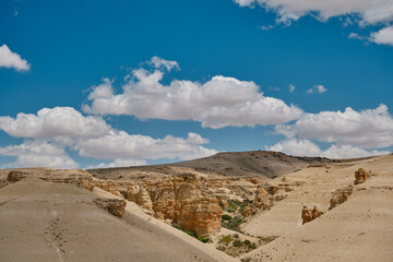A huge stones and sky with white clouds in Kusca Turkey during sunny day. Desert stone and blue sky during sunny day and summer