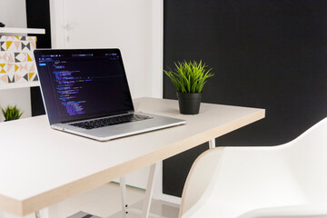 Minimalistic digital nomad home office workspace