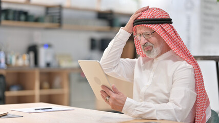 Old Arab Businessman Reacting to Loss on Tablet at Work 