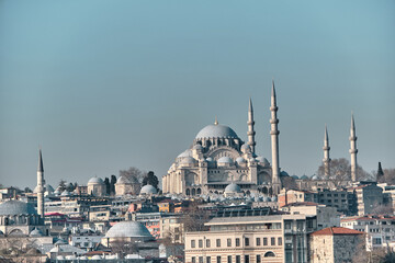 Naklejka premium Turkey istanbul 03.03.2021. Istanbul eminonu square and port with suleymaniye mosque and internal transportation ferry in istanbul bosporus and galata bridge